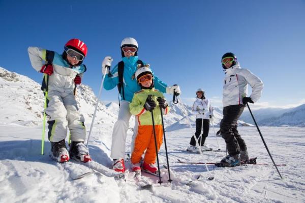 family skiing together