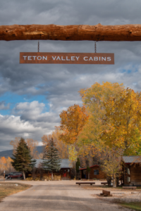 welcome to teton valley cabins front entrance sign
